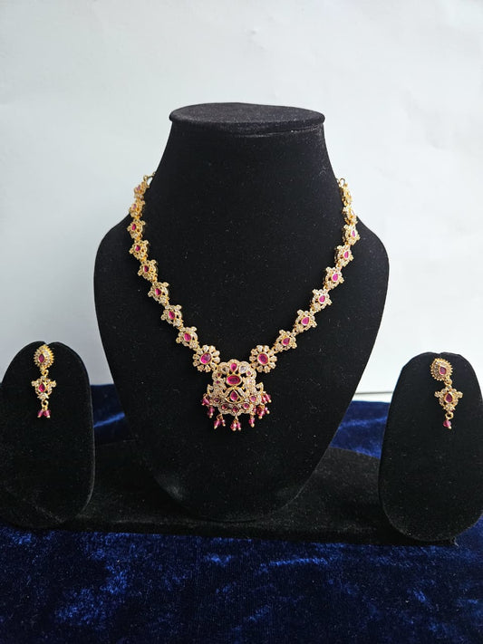 Elegant Gold-Plated Jewelry with Pink Stones